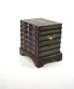 A Victorian style cellarette modelled as a stack of antiquarian books with leather covered lid and