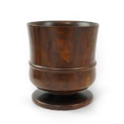 A lignum vitae wassail bowl, late 18th/early 19th century, with raised band to the girdle, on a