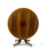A Regency cut brass inlaid and gilt metal mounted circular rosewood breakfast table, the birds-eye