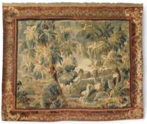 A mid to late 18th century French Aubusson tapestry of a bird, possibly a heron, within a tree lined