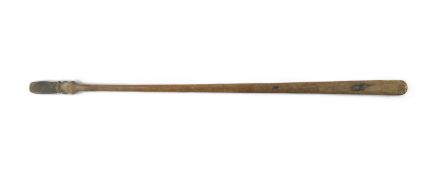 A Maori carved hardwood staff, taiaha, 19th century, with a carved janiform tiki head terminal,