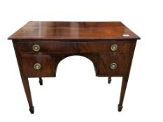 A George III rectangular inlaid mahogany kneehole dressing table, fitted one long and two short