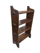 A small Arts & Crafts oak three tier open bookcase, width 60cm, depth 21cm, height 96cm
