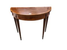 A George III satinwood banded mahogany D shaped folding card table, width 91cm, depth 45cm, height