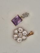 A modern 9ct gold and single stone rectangular cut amethyst pendant, with diamond chip set bale,