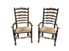 A set of six Lancashire style elm and beech rush seat ladderback dining chairs, two with arms