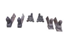 Three pairs of Victorian cast iron fire dogs and a fireback, damaged