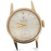 A lady's 10k yellow metal Rolex Precision manual wind wrist watch, with baton numerals and