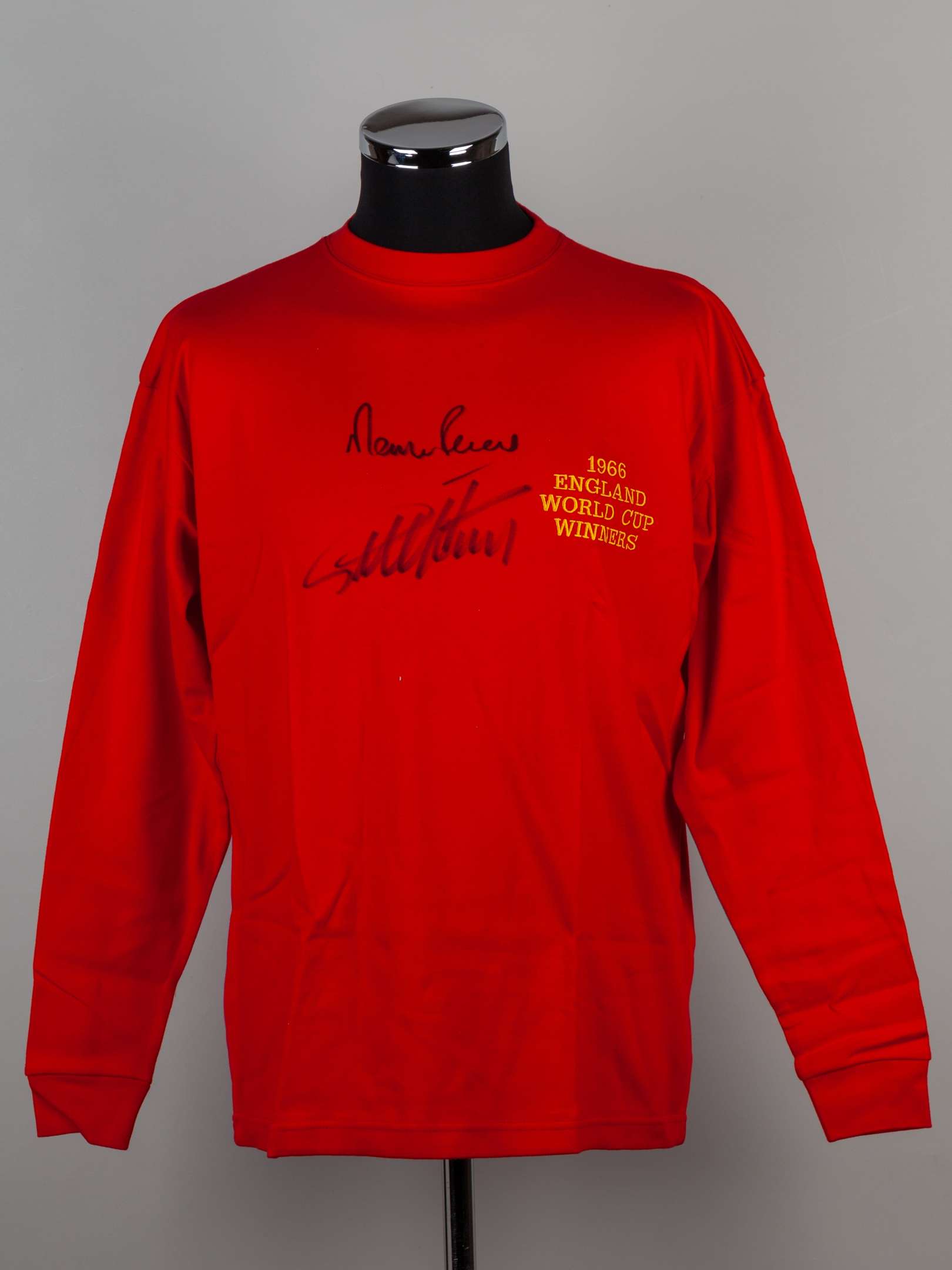 A red replica England Geoff Hurst and Martin Peters 50th Anniversary autographed shirt