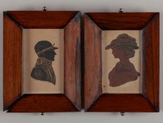 A pair of 19th century silhouette portraits of a jockey and a lady