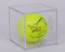 An autographed Novak Djokovic Wimbledon tennis ball, 2011