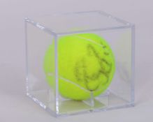 An autographed Roger Federer Wimbledon tennis ball, 2005