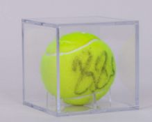 An autographed Roger Federer Wimbledon tennis ball, 2007