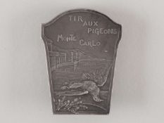 A white-metal pigeon shooting lapel badge