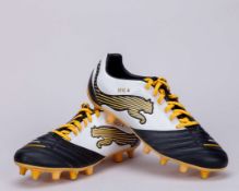 Cesc Fabregas a pair of black, white and yellow Puma football boots