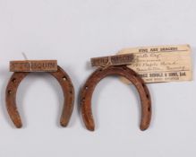 A pair of horse shoes from the Classic-winning racehorses Persimmon and St. Frusquin