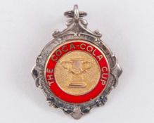 A silver and enamel Leeds United v. Aston Villa Coca-Cola Cup runners-up medal, 1996