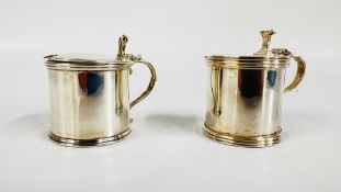 TWO SILVER MUSTARD POTS WITH BLUE GLASS LINERS TO INCLUDE A BIRMINGHAM 1984, MAKER J.B.