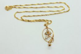 A GOLD NECKLACE STAMPED 916 SUPPORTING A PEARL AND OPAL SET PENDANT,