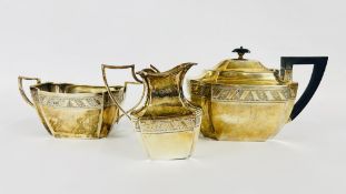 AN ANTIQUE SOLID SILVER THREE PIECE TEA SERVICE OF RECTANGULAR INDENTED FORM,