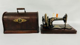 A VINTAGE SINGER MANUAL SEWING MACHINE