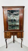 A GEORGIAN OAK GLAZED CORNER CUPBOARD ON STAND W 95CM H 183CM.