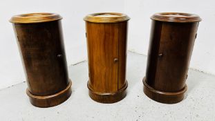 THREE CYLINDRICAL MAHOGANY POT CUPBOARDS WITH INSET WHITE MARBLE TOPS.