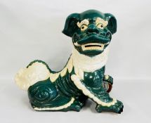 A LARGE GLAZED POTTERY STUDY OF A 