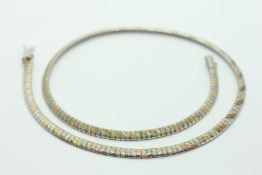 A TRI--COLOURED CHOKER STYLE NECKLACE MARKED 749 - L 44CM.