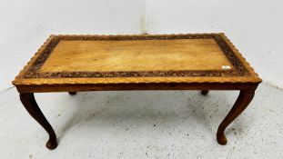 RECTANGULAR MAHOGANY COFFEE TABLE WITH CARVED FOLIAGE DETAIL - LENGTH 107CM WIDTH 50CM.
