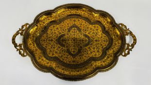 AN ELABORATE BRASS TWO HANDLED PERSIAN STYLE TRAY, LENGTH 28 INCHES.