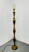 AN IRANIAN DESIGN BRASS LAMP STANDARD WITH FROSTED GLASS FLAME SHADE - SOLD AS SEEN.