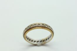 AN 18CT GOLD STONE SET ETERNITY RING.