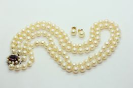 A DOUBLE ROPE OF UNIFORM PEARLS,