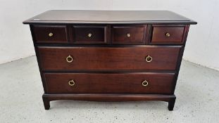 A STAG MINSTREL SIX DRAWAER CHEST, THE FOUR SHORT DRAWERS OVER TWO LONG W 107CM D 47CM H 72CM.
