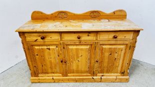 A SOLID NATURAL PINE THREE DRAWER,