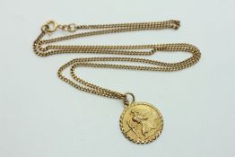 A 9CT GOLD ST. CHRISTOPHER PENDANT A/F SUSPENDED ON A 9CT GOLD CHAIN - L 46CM.
