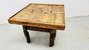 A RUSTIC HARD WOOD LAMP TABLE 60CM X 60CM.