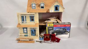 A DOLLS HOUSE WITH INTERIOR ACCESSORIES.