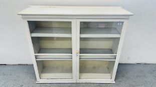 A WHITE PAINTED TWO DOOR CABINET, FORMERLY THE TOP HALF OF A DRESSER, 121CM WIDE.