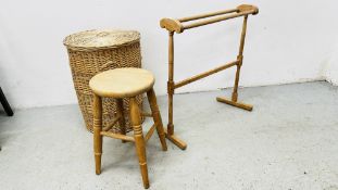 A STRIPPED PINE TOWEL RAIL ALONG WITH A WICKER BASKET WITH COVER.