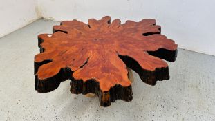 A RESIN FINISH HARDWOOD SLICE / SLAB OCCASIONAL TABLE ON A RAISED BASEE W 110 X 100 X H 48CM.
