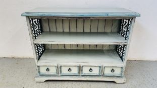 A DISTRESSED PAINTED PINE BOOKSHELF WITH FOUR DRAWERS TO BASE AND IRON CRAFT DETAIL W 100CM D 35CM