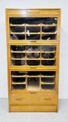AN OAK AND PLYWOOD HABERDASHERY DISPLAY CABINET, 107CM WIDE, BEARING LABEL DUDLEY & COMPANY.