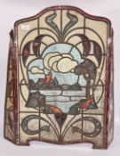 A 1930s TIN FIRE SCREEN IN THE FORM OF A STAINED GLASS WINDOW, 70CM HIGH.