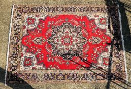 AN EASTERN RED PATTERNED CARPET, 290 X 198CM.