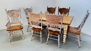 A SOLID PINE DISTRESSED KITCHEN DINING TABLE 152CM X 88CM ALONG WITH SEVEN COLONIAL STYLE DINING