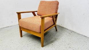 A MODERN JOHN LEWIS SOLID LIGHT OAK OPEN ARM CHAIR.