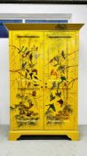 A C19th TWO DOOR WARDROBE, LATER DECORATED WITH BIRDS ON A YELLOW GROUND,