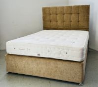 A KINGSIZE DIVAN BED COMPLETE WITH MATCHING PADDED HEADBOARD FITTED WITH MILLBROOK OXFORD NATURAL